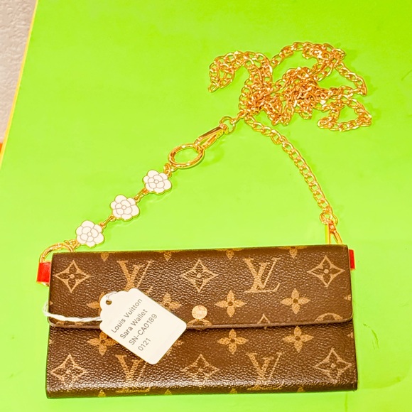 Louis Vuitton Handbags - Louis Vuitton Brown Monogram Sarah long bifold wallet this is Labeled feature
